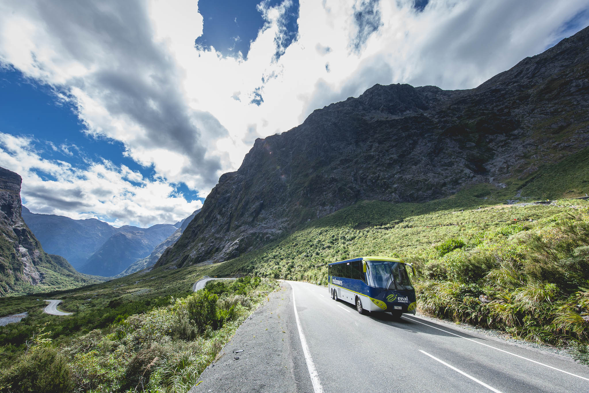 Bus driving through Fiordland National Park